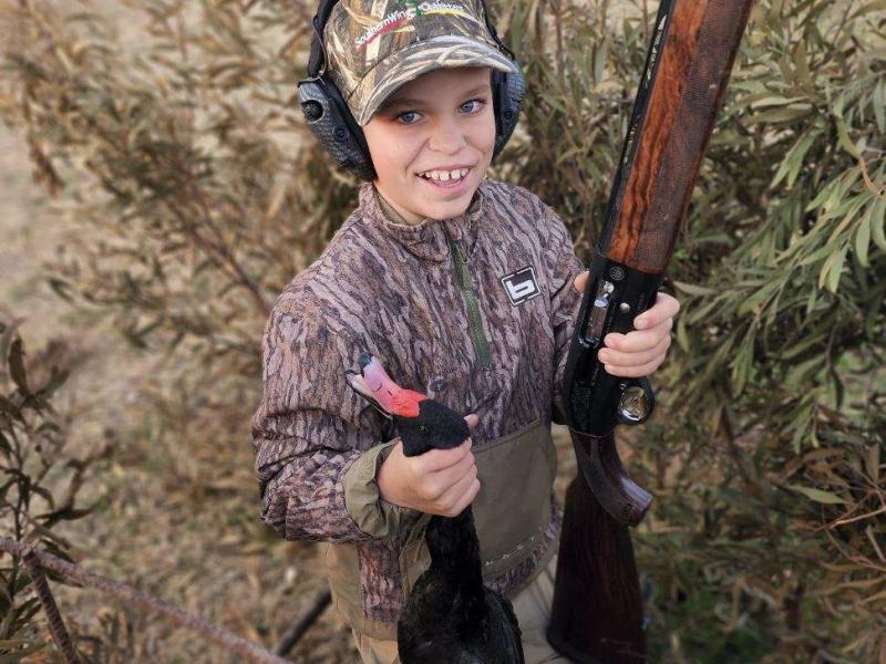 Seth Almond with first rosybilled pochard he shot while hunting with his family in Argentina