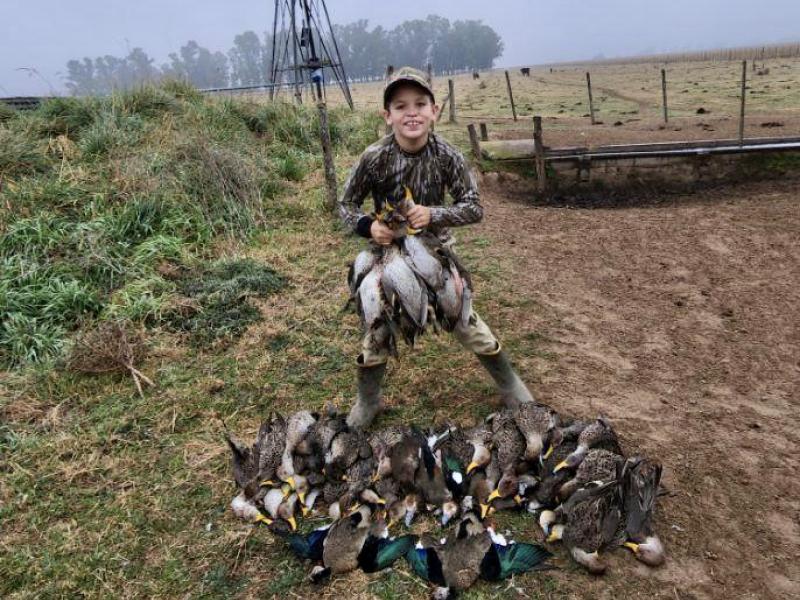Seth Almond, Camden, SC shows off some of the ducks he picked up on his first international hunt in Argentina