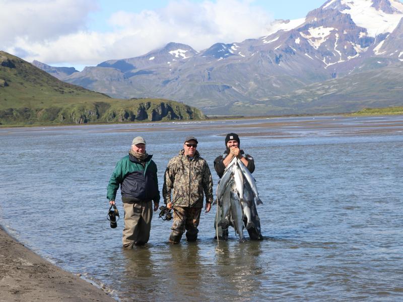 wings hunters in alaska water with ducks