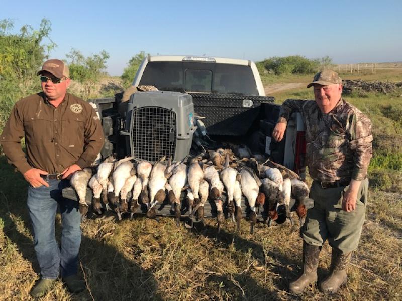 Wings hunters with bird trophy