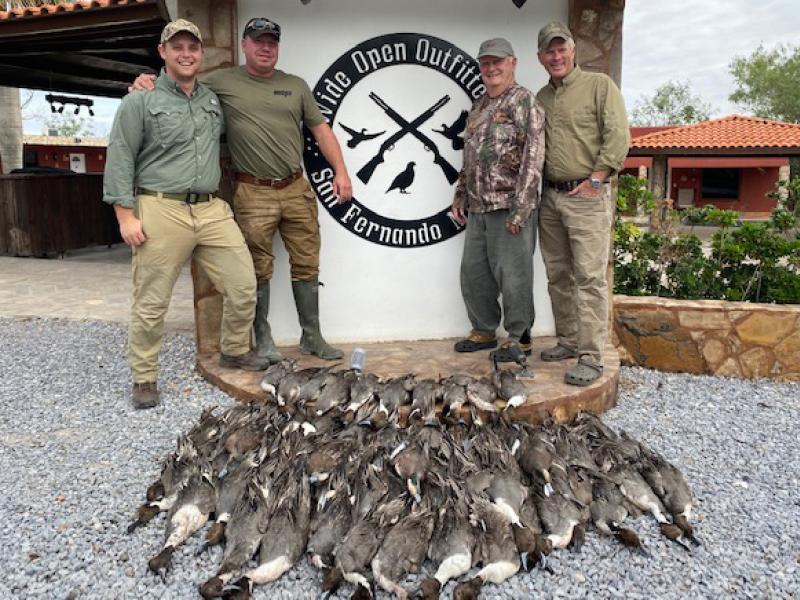 wings duck hunters with duck trophies